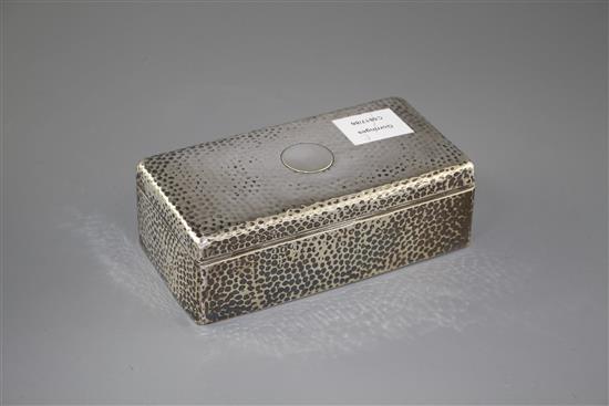 An Edwardian planished silver mounted rectangular cigarette box, Joseph Braham, London, 1903, 18cm, gross 21 oz.